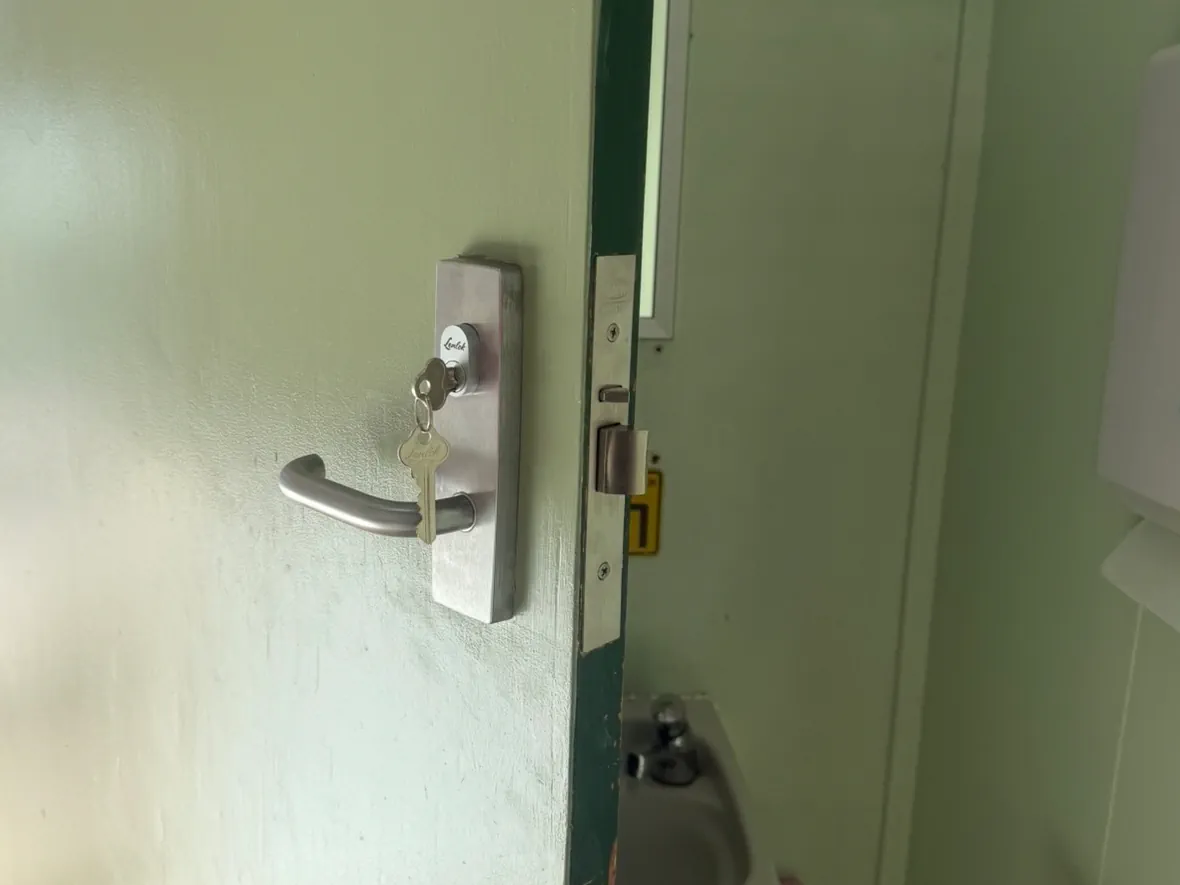 Bathroom door commercial maintenance project